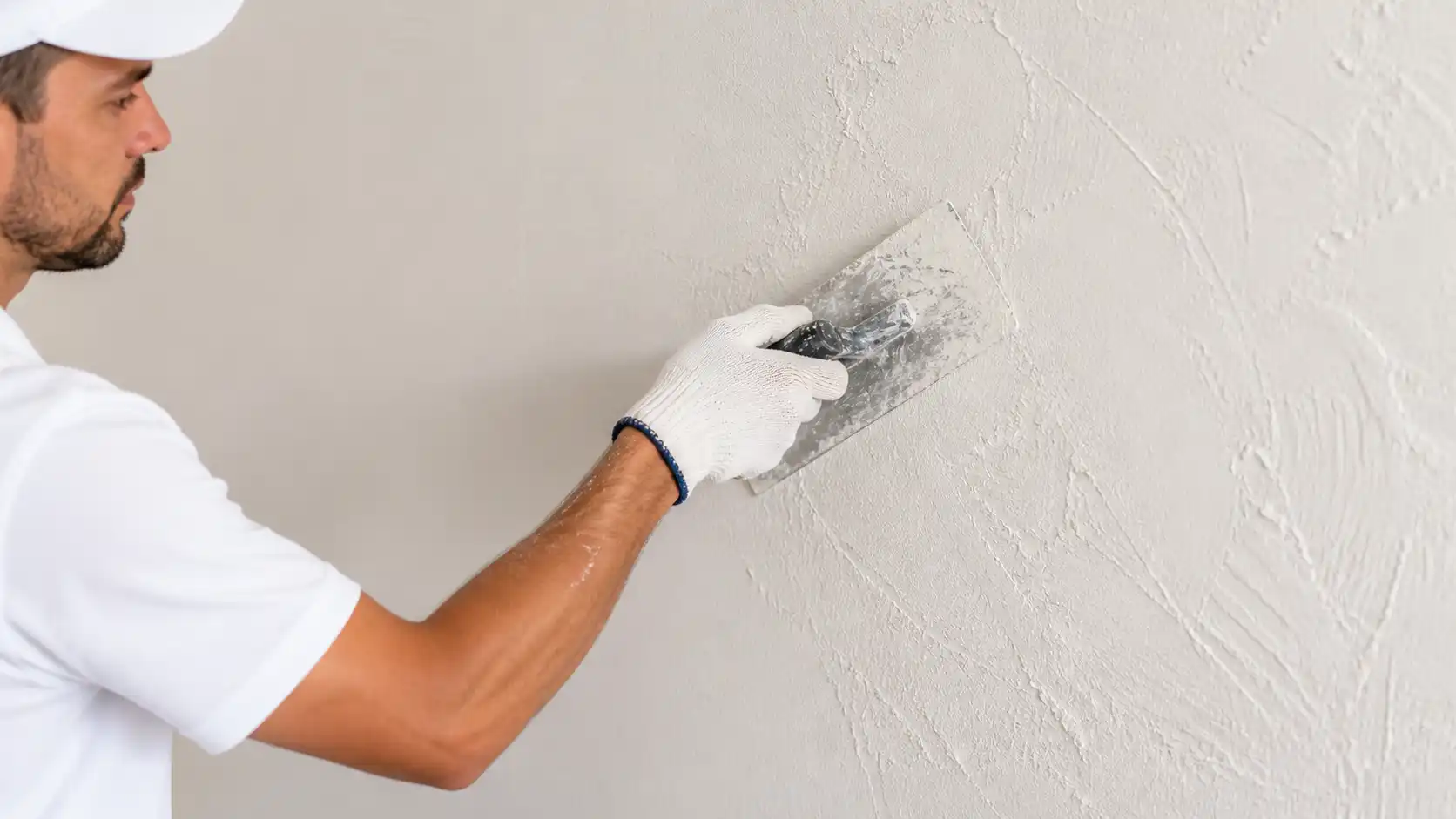 Expert texture matching showing seamless transition between repaired and original wall texture
